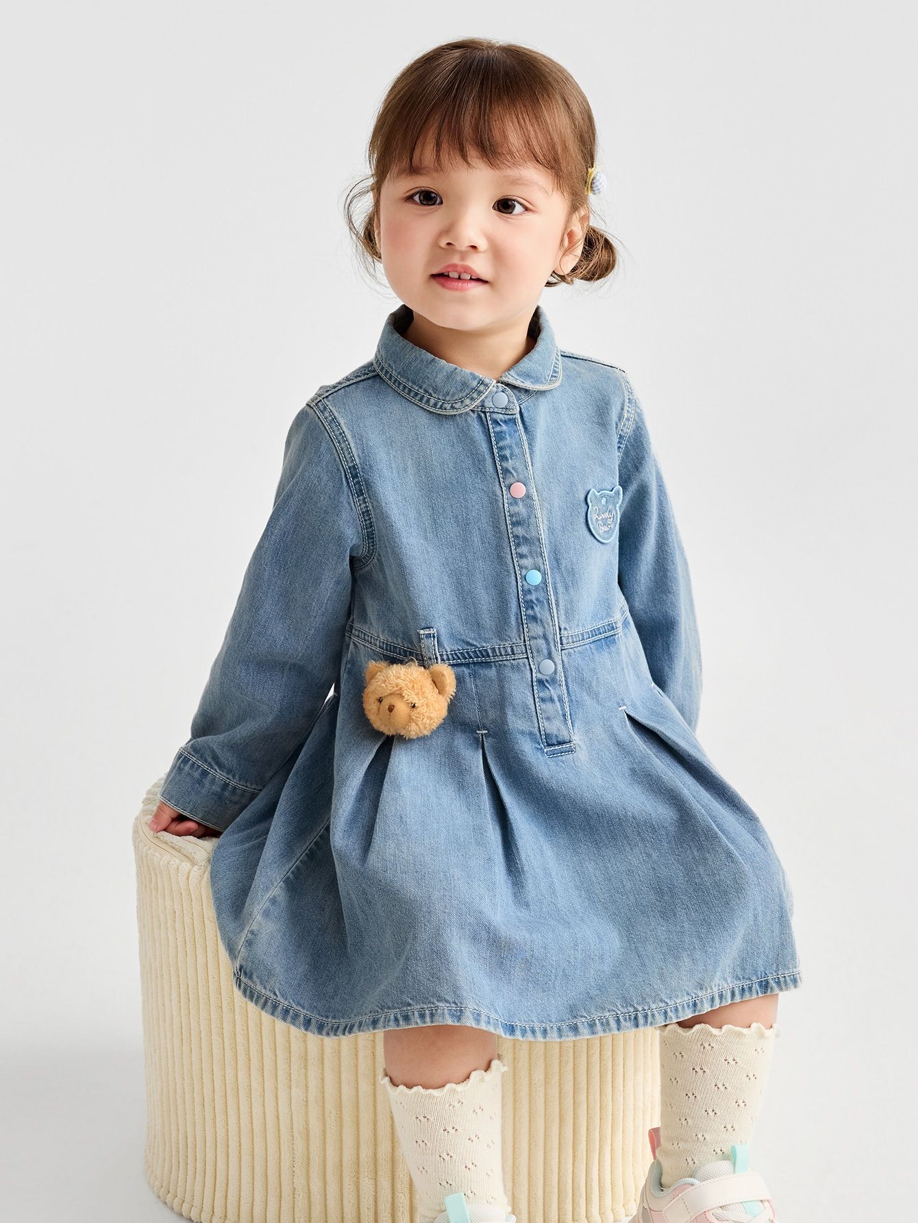 toddler denim dress Wrangler West Embroidered Toddler/Infant Triple A Farm & Ranch, LLC The dress features a stylish denim top with front buttons and adorable ruffled sleeves Shea Baby Toddler Girls' Aztec